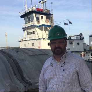 Sean P Smith near a towboat